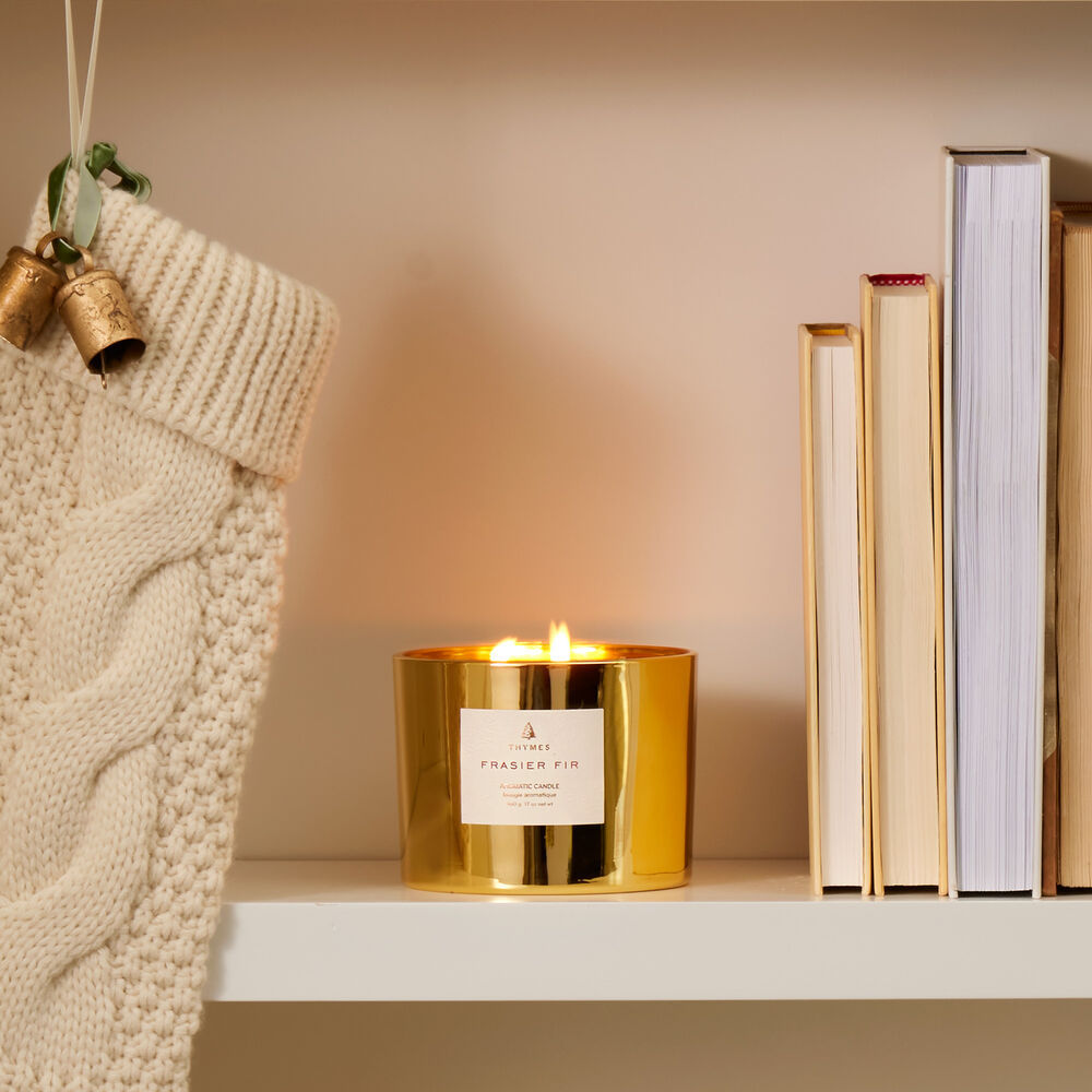 Frasier Fir Gold 3-Wick Candle Lit on Bookshelf image number 2